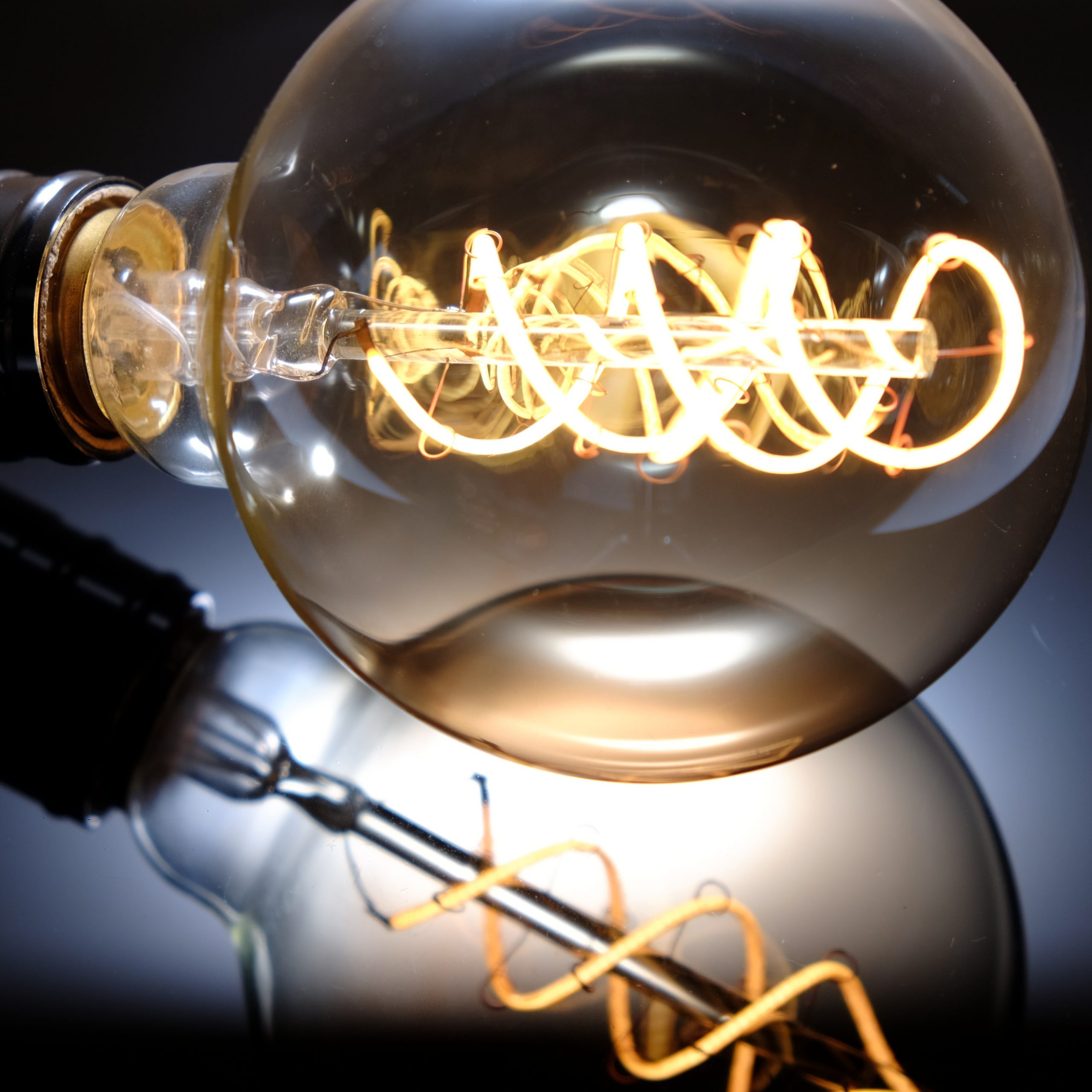 Lightbulb with soft glowing coiled wire.